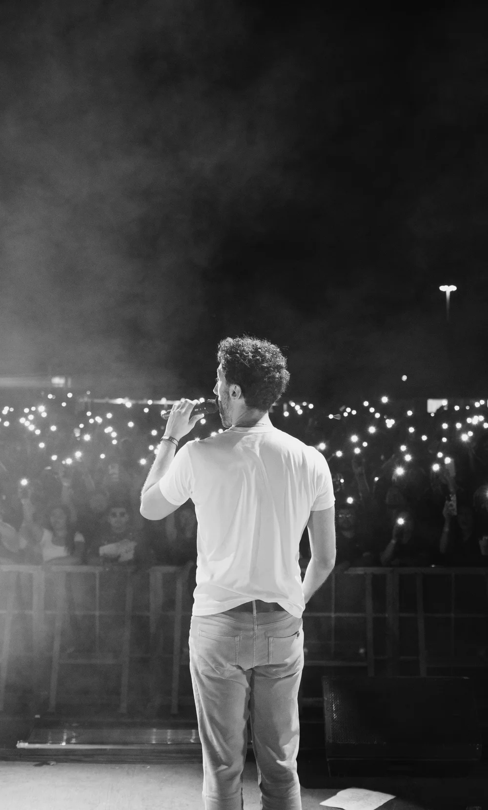 Sea of phone lights from the stage during the headline set